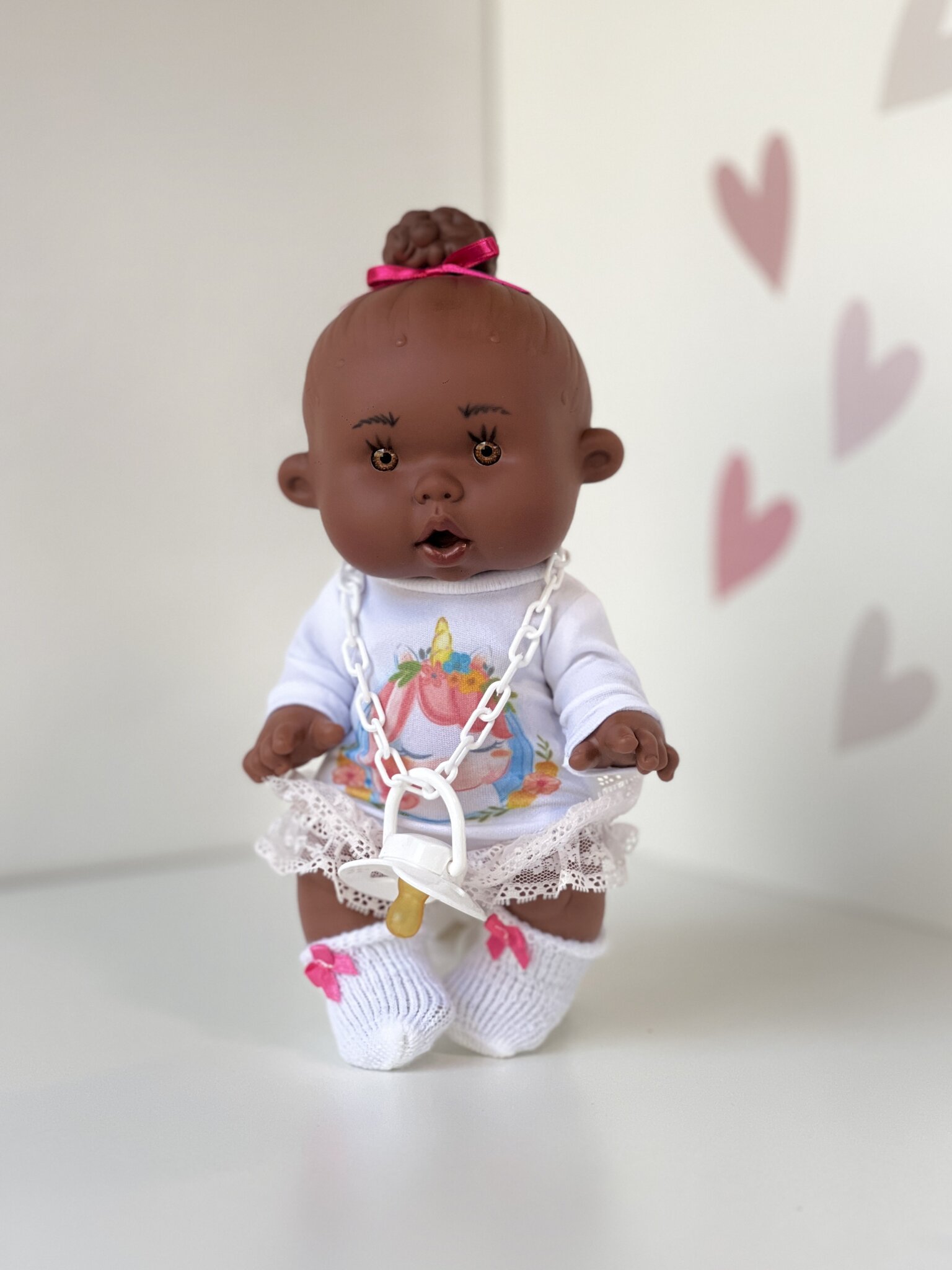 Scented doll, girl with bun, dark skin, 26cm (Marina&Pau)